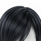 Black hair extension on a white background