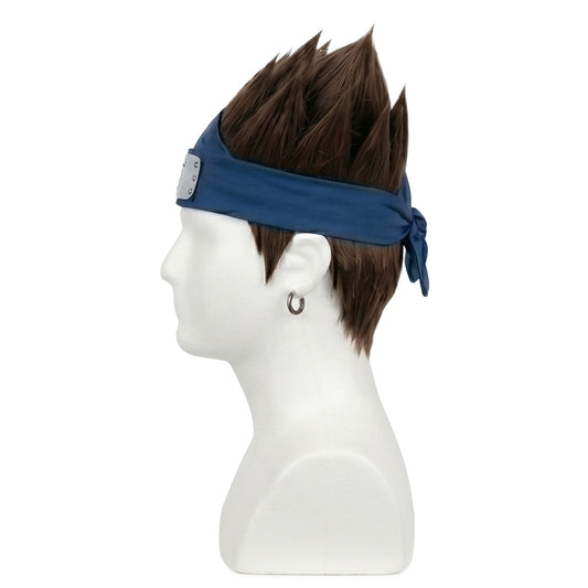 Side view showing tufts of hair styled around the blue forehead protector
