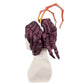 Side view of Entoma wig showing spider leg-inspired hair styling