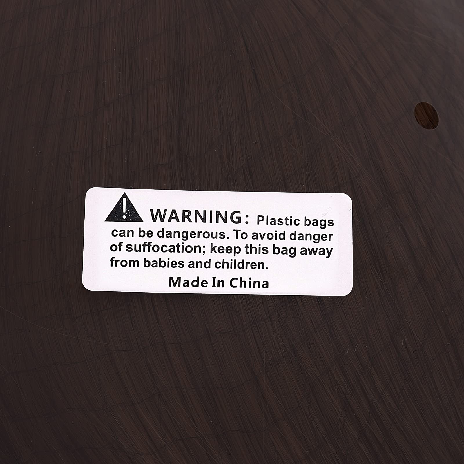 Premium packaging of Joseph Joestar cosplay wig showing protective netting and neatly arranged dark brown fibers