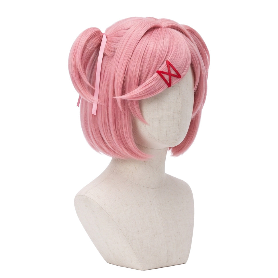 Three-quarter view of Natsuki cosplay wig showing pastel pink hair, red ribbon twin-tails, side bangs, and forehead locks