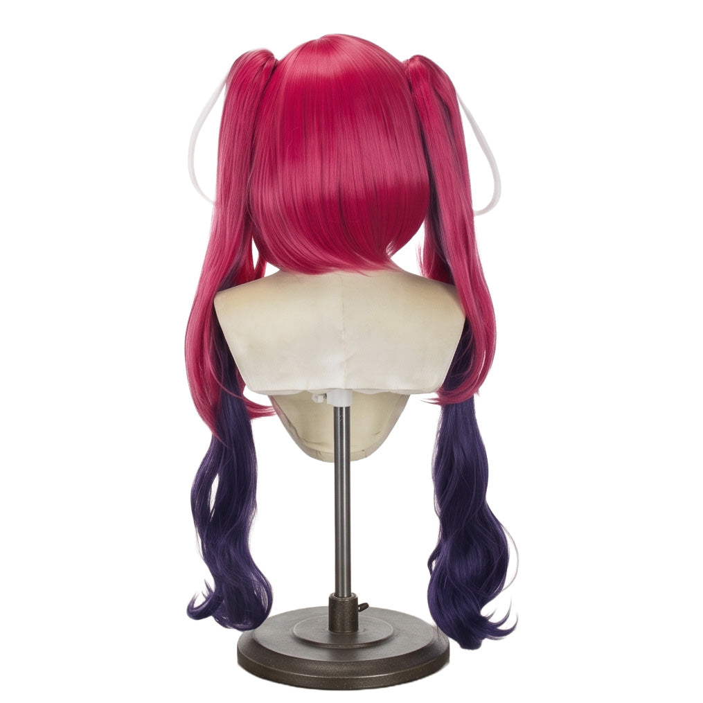 Back view of Velvette Hazbin Hotel cosplay wig showing long desire-red curly pigtails with faded dark navy-blue inner sections and white streaks